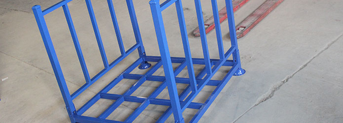Steel pallets, wire mesh cages and stacking racks